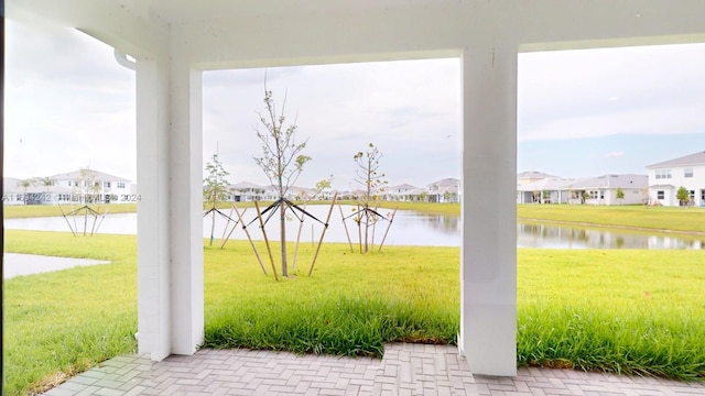 view of patio featuring a water view