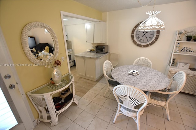 dining area with light tile patterned flooring