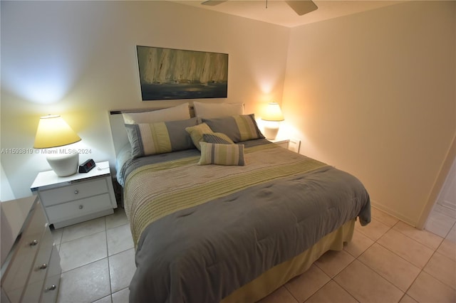 tiled bedroom featuring ceiling fan