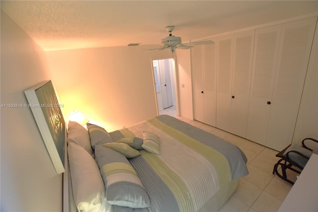 tiled bedroom with ceiling fan