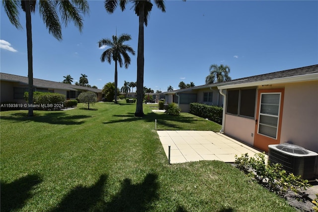 view of yard with central AC unit