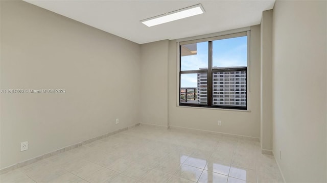 empty room featuring light tile flooring