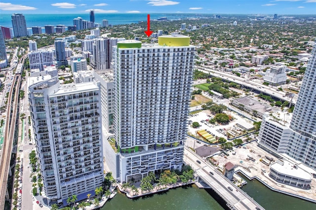 birds eye view of property with a water view