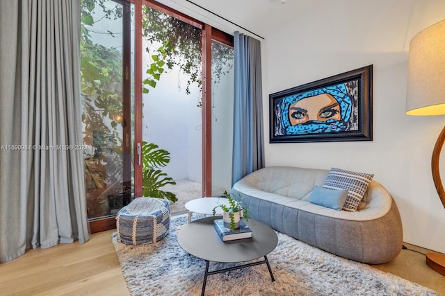 living area with hardwood / wood-style floors