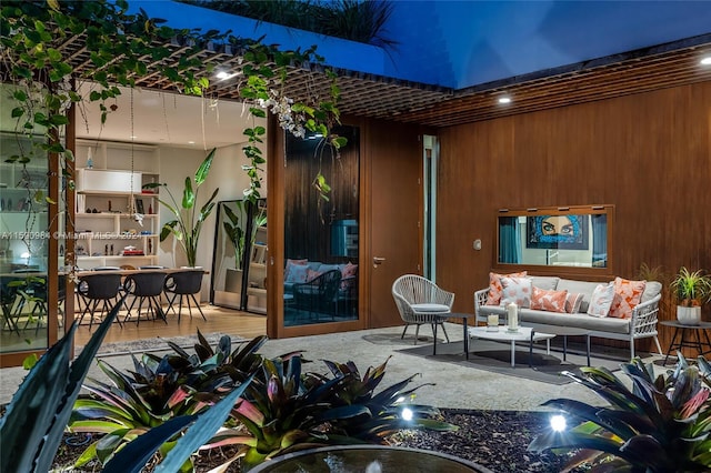 patio terrace at night featuring an outdoor living space