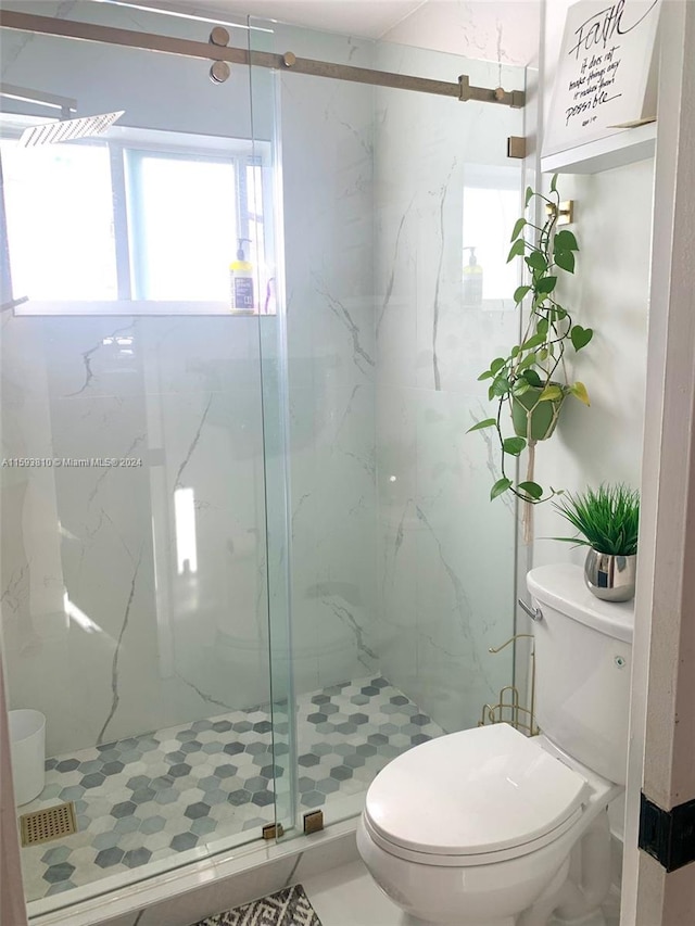 bathroom featuring walk in shower and toilet