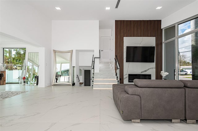 living room with tile flooring and a wealth of natural light