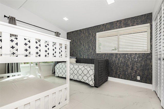 tiled bedroom with lofted ceiling