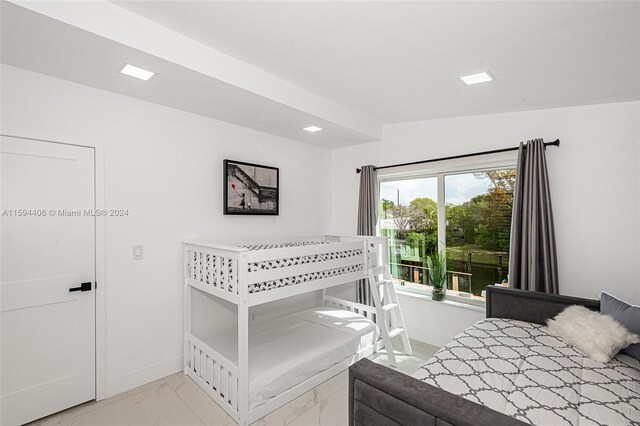 bedroom with light tile flooring