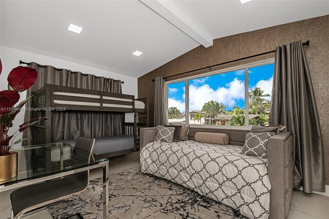 bedroom featuring lofted ceiling with beams