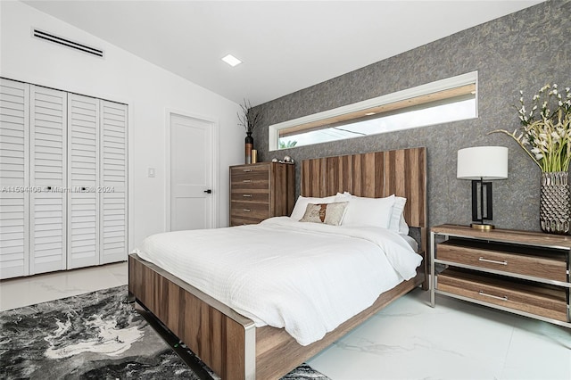 bedroom with tile floors and lofted ceiling