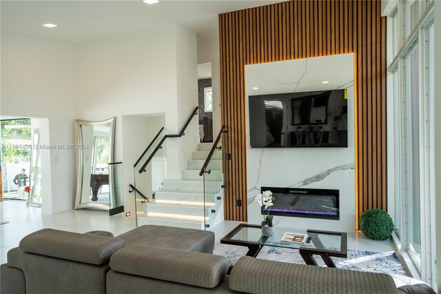 living room with a towering ceiling