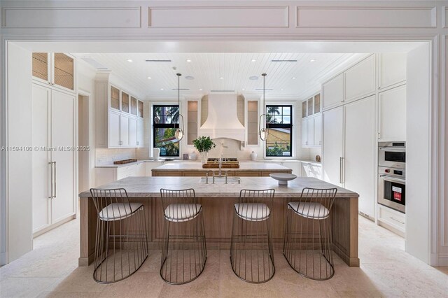 living room with crown molding and a tray ceiling