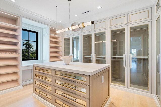 interior space with sink, white cabinets, and backsplash