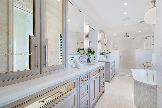 bathroom featuring a washtub, recessed lighting, visible vents, a stall shower, and vanity