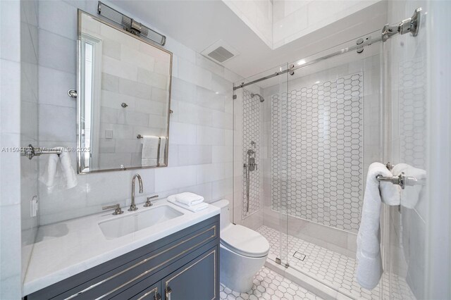 bathroom featuring tile patterned flooring, vanity, and toilet