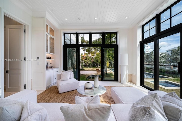 interior space featuring crown molding and wood ceiling