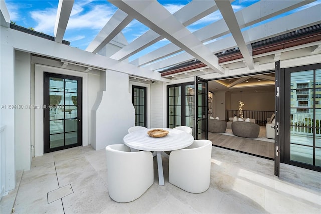 view of patio featuring outdoor dining area and a pergola