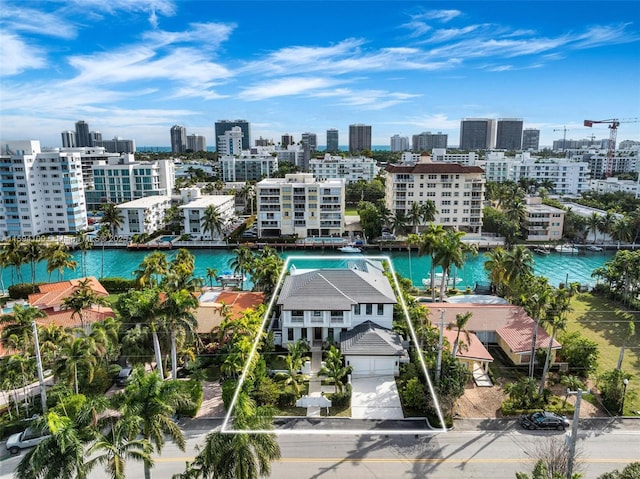 bird's eye view featuring a water view and a view of city