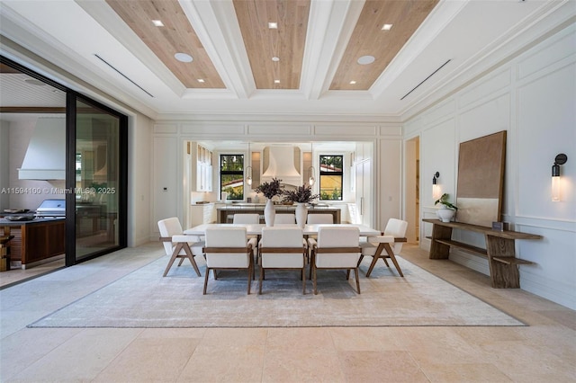 dining space featuring crown molding, beam ceiling, and a decorative wall