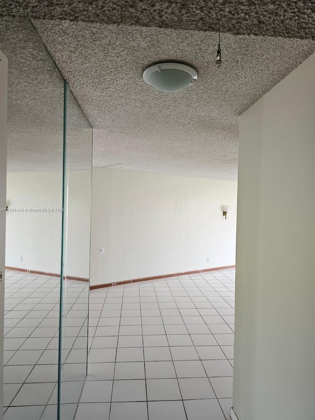 6921 Environ Blvd Unit 4N, Lauderhill, FL 33319 - unfurnished room with a textured ceiling and light tile patterned floors
