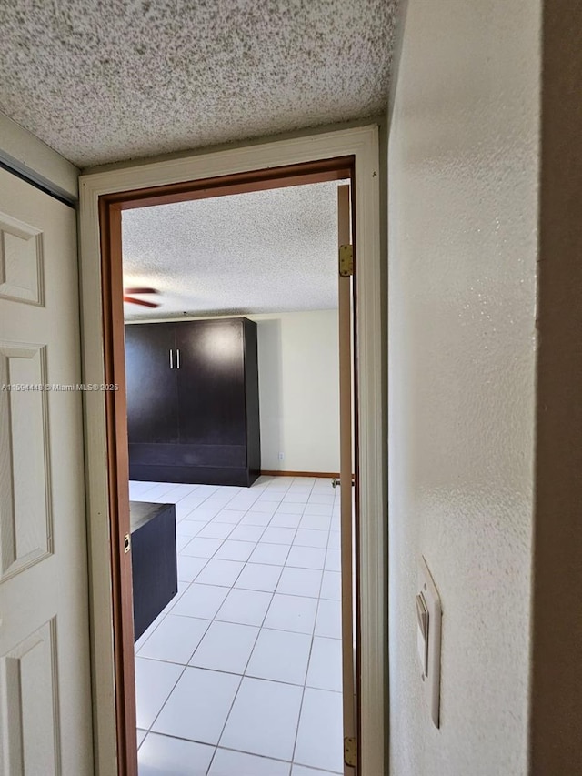 6921 Environ Blvd Unit 4N, Lauderhill, FL 33319 - hallway featuring a textured ceiling and light tile patterned floors
