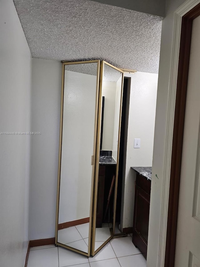 6921 Environ Blvd Unit 4N, Lauderhill, FL 33319 - bathroom featuring vanity, a textured ceiling, and tile patterned floors