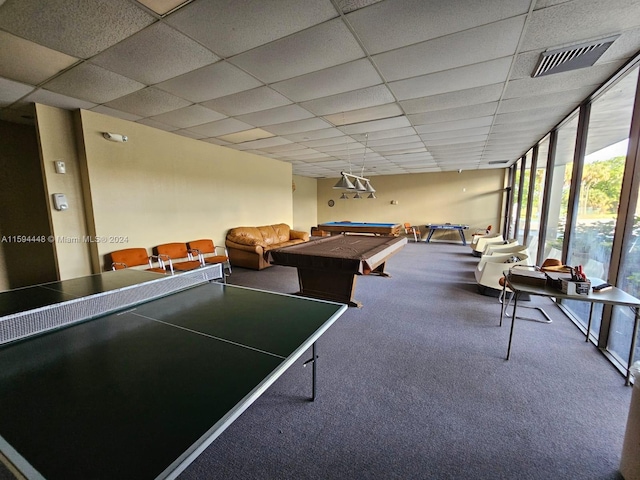 playroom featuring carpet flooring, a drop ceiling, billiards, and a wall of windows