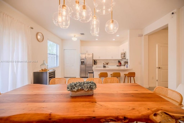 dining space featuring a chandelier