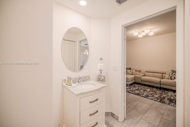 bathroom featuring tile floors and large vanity