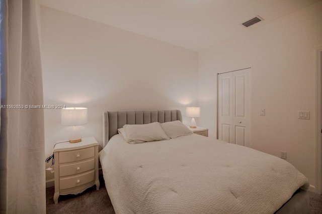 carpeted bedroom with a closet