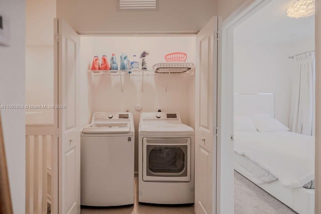 laundry room featuring washing machine and clothes dryer