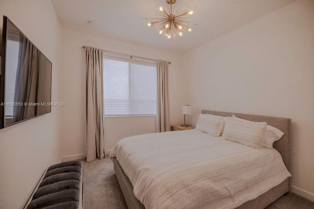 bedroom featuring carpet and an inviting chandelier