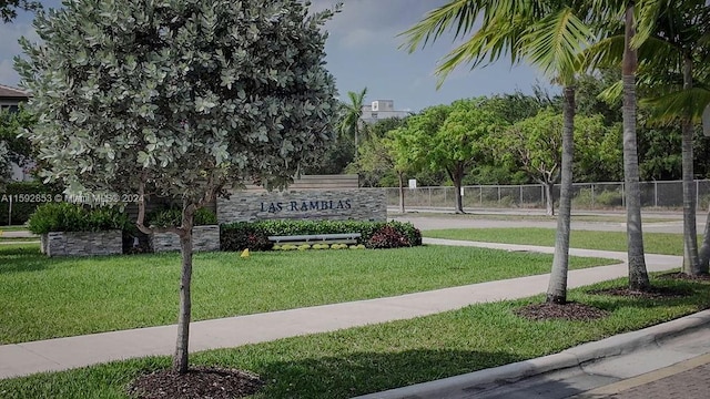 community / neighborhood sign with a lawn