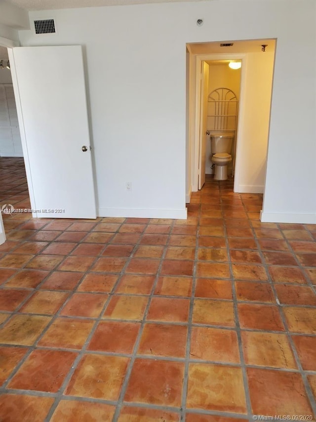 empty room featuring tile floors