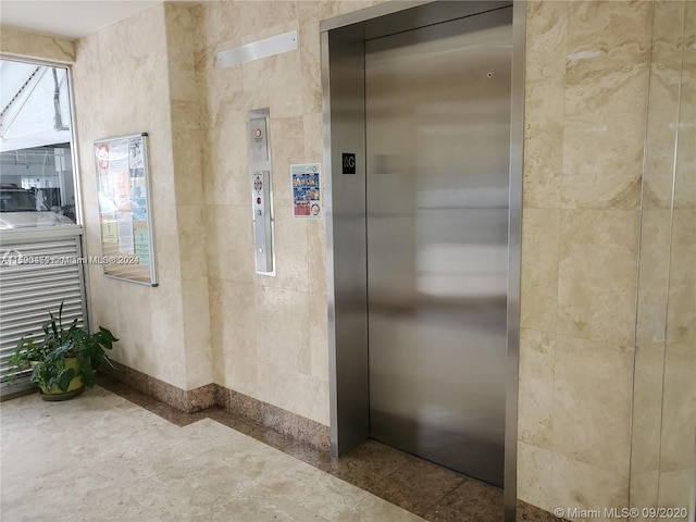 view of exterior entry featuring elevator