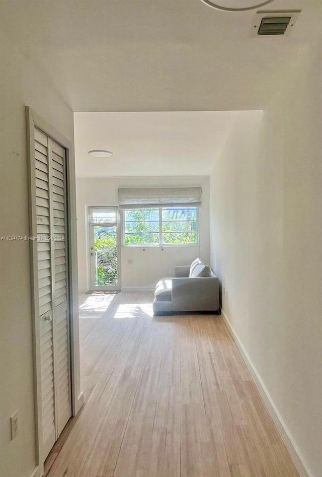 corridor featuring light hardwood / wood-style floors