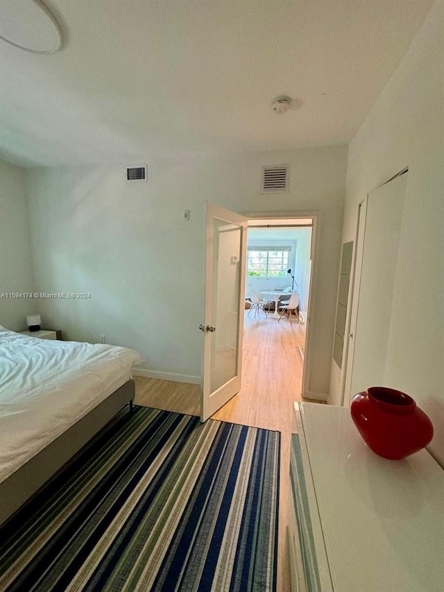 bedroom with light hardwood / wood-style floors