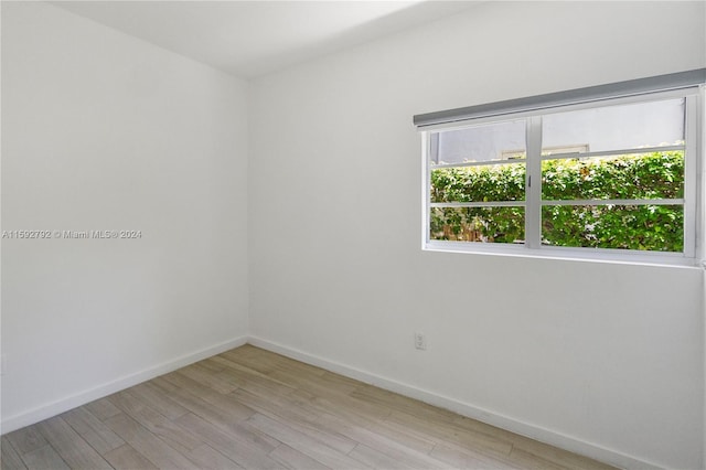 spare room with light wood-type flooring