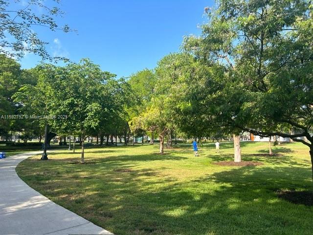 view of property's community with a yard