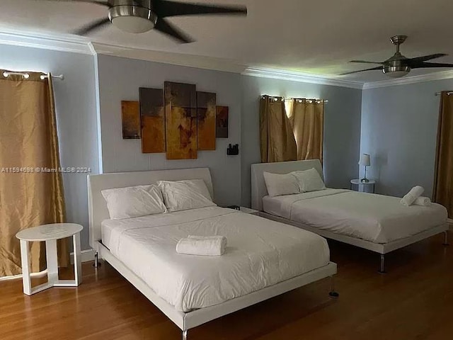 unfurnished living room featuring a wealth of natural light, ceiling fan, and dark hardwood / wood-style floors