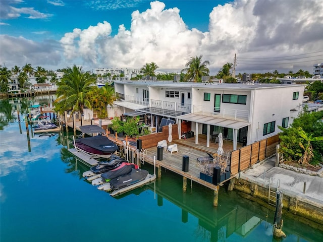 rear view of house featuring a water view