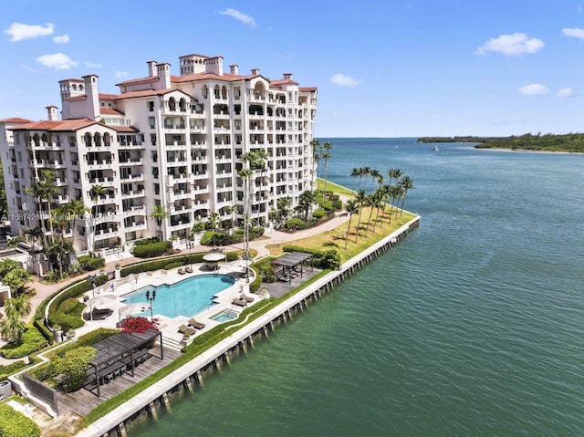 birds eye view of property with a water view