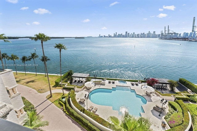 birds eye view of property with a water view