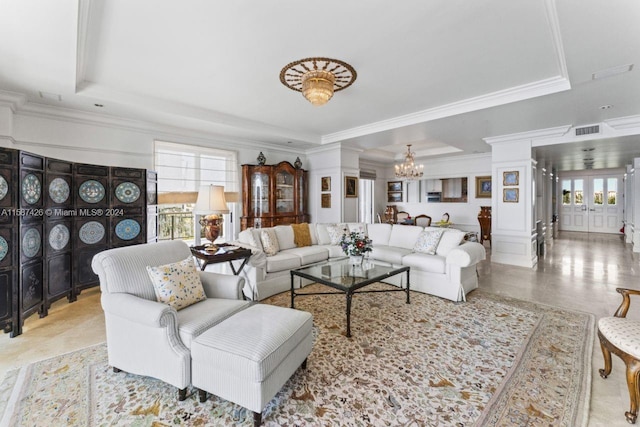 tiled living room featuring plenty of natural light, a raised ceiling, crown molding, and a chandelier