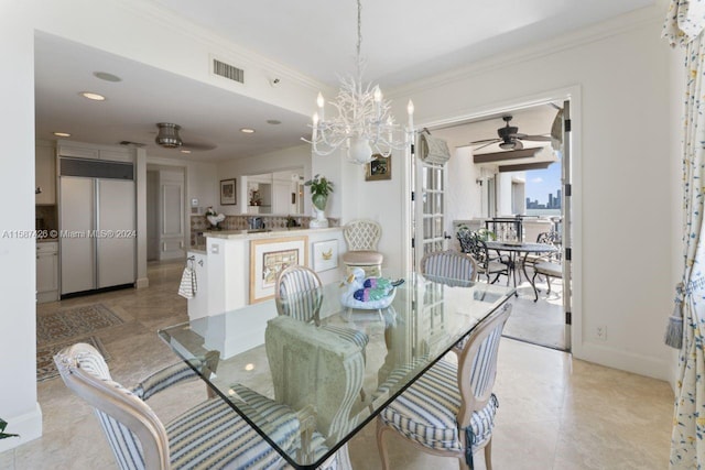 dining area with ceiling fan with notable chandelier, ornamental molding, and light tile floors