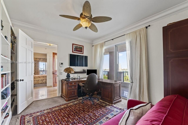 tiled home office featuring plenty of natural light, ceiling fan, and crown molding