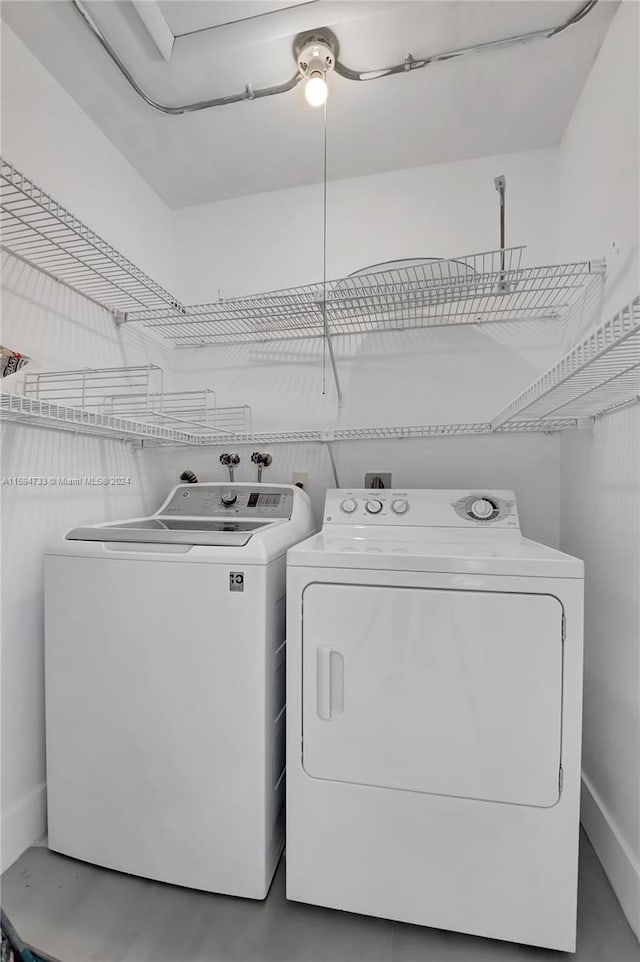 laundry room with separate washer and dryer