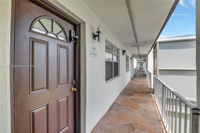 property entrance featuring covered porch