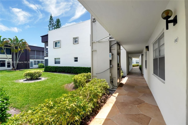 view of side of home featuring a lawn